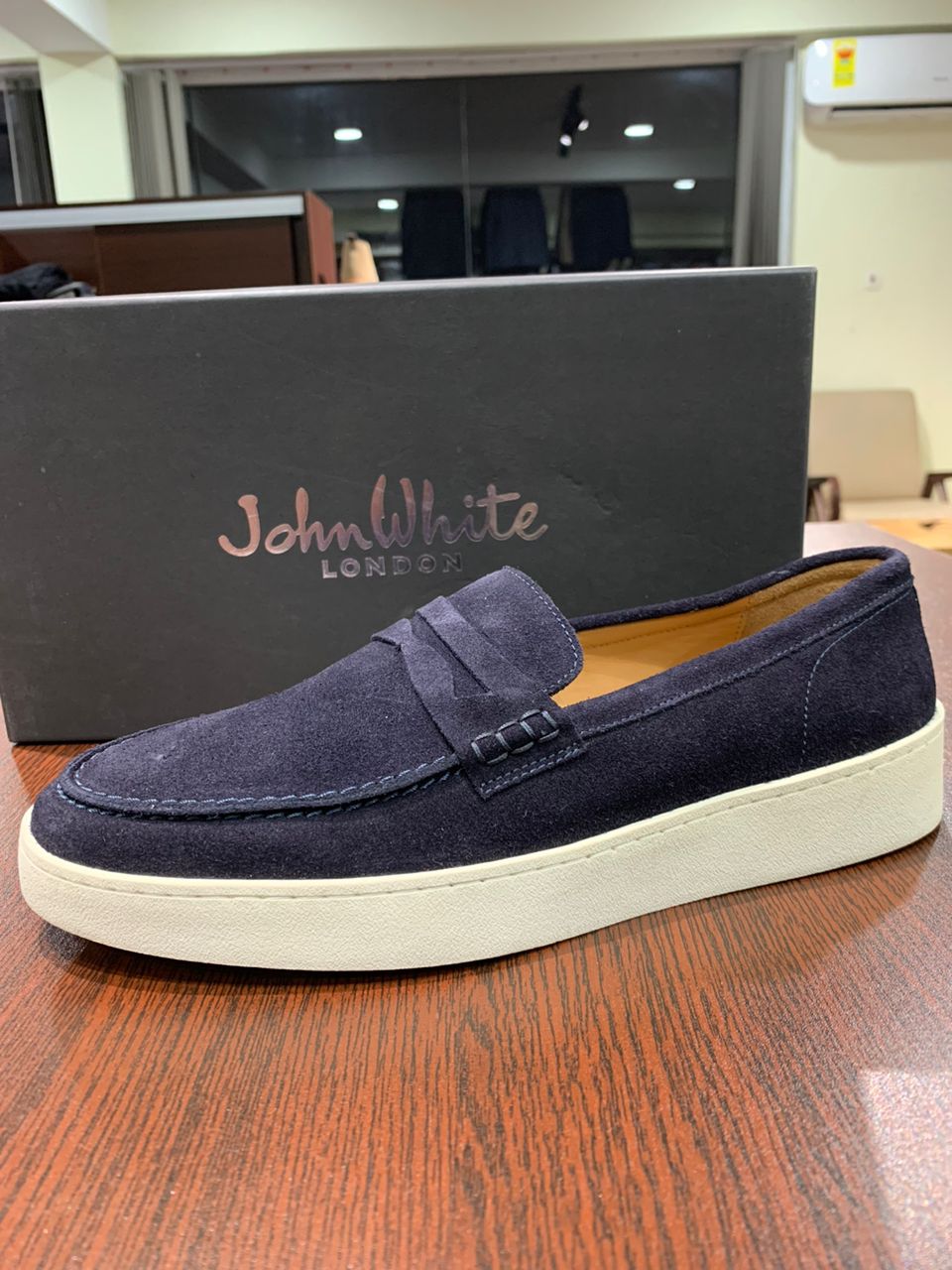 John White navy suede slip on white rubber sole