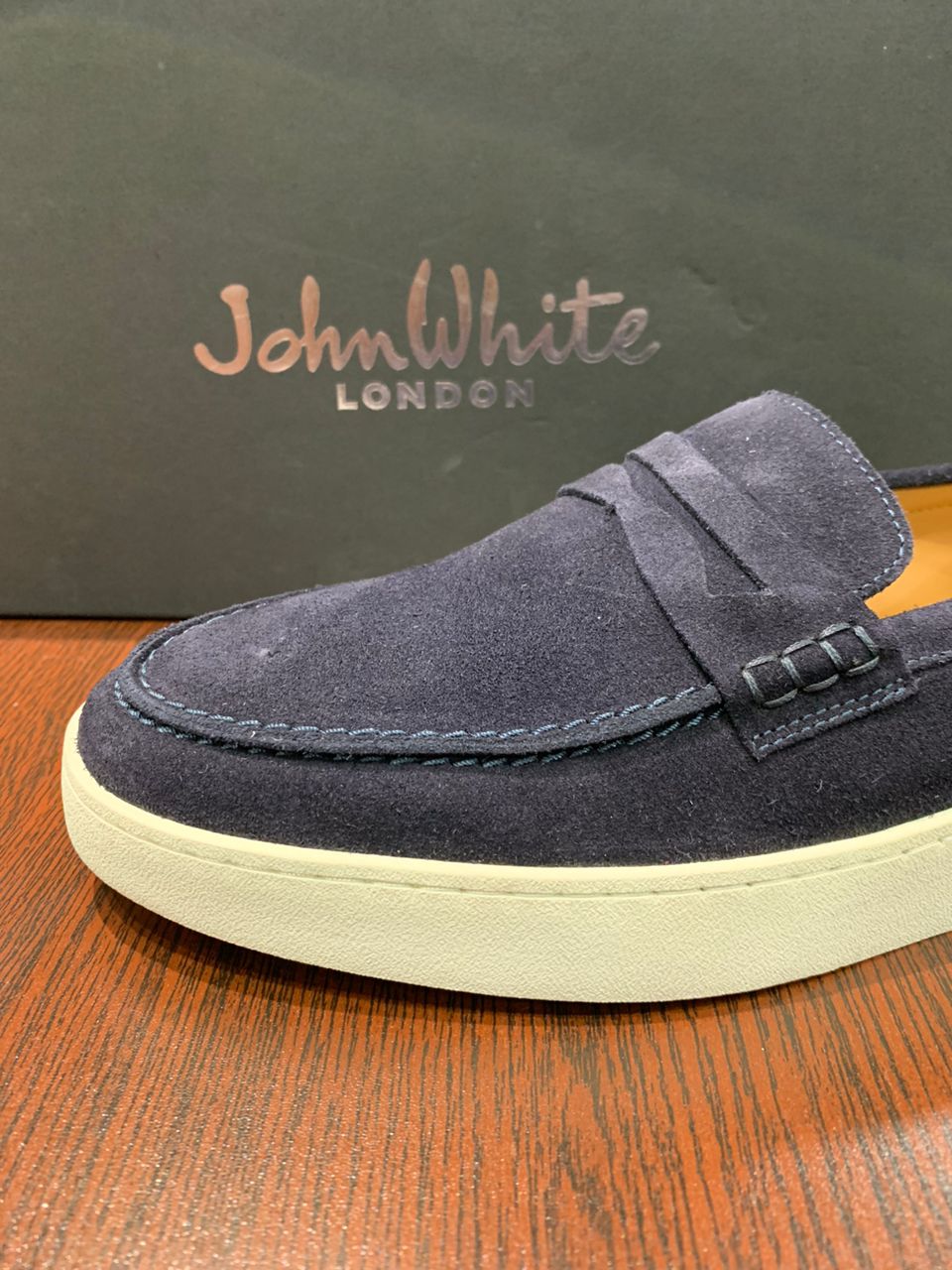 John White navy suede slip on white rubber sole